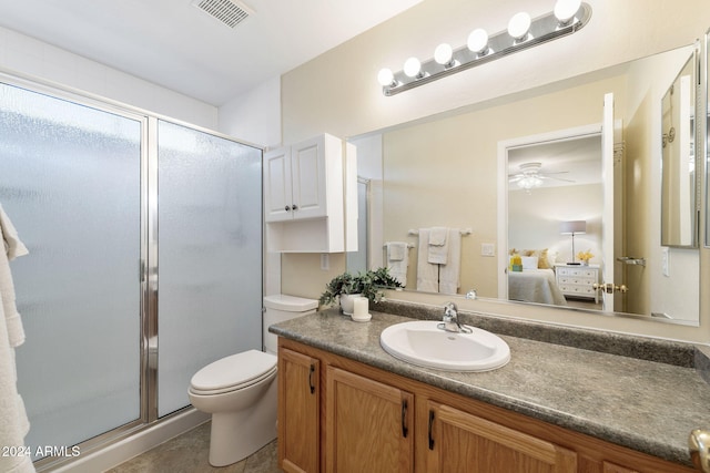 bathroom featuring vanity, toilet, and walk in shower