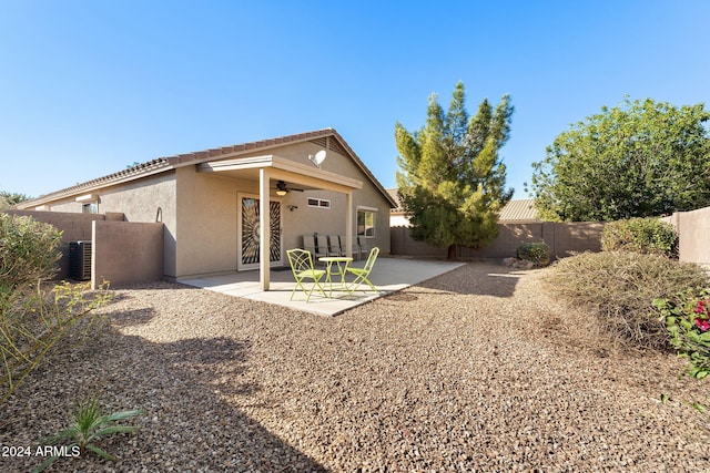 back of house with a patio area and ceiling fan