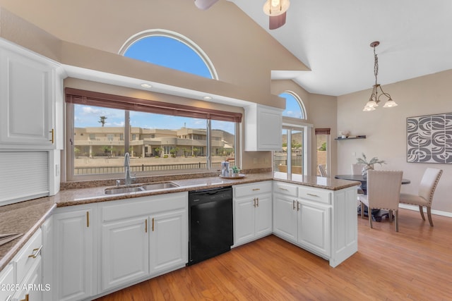 5822 W Abraham Ln, Glendale, AZ 85308 - kitchen featuring black dishwasher, high vaulted ceiling, plenty of natural light, light wood-style floors, and white cabinets