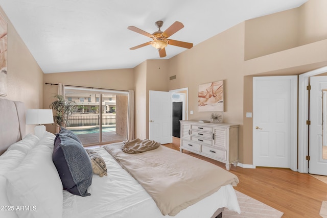 5822 W Abraham Ln, Glendale, AZ 85308 - bedroom with access to outside, light wood-style flooring, a ceiling fan, and high vaulted ceiling