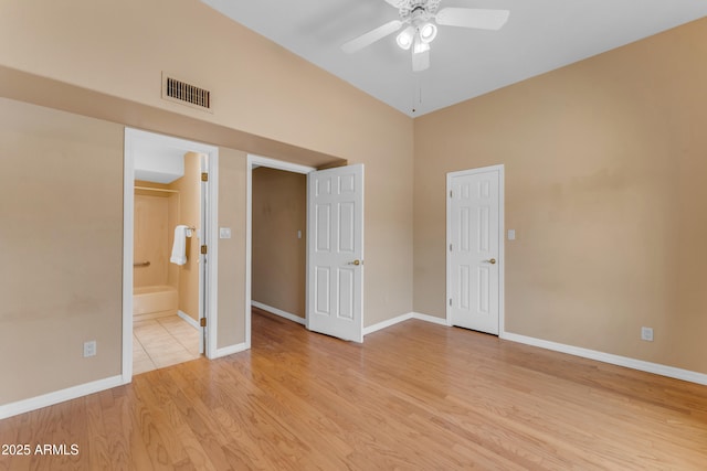 5822 W Abraham Ln, Glendale, AZ 85308 - unfurnished bedroom with light wood-style flooring, ensuite bath, and ceiling fan