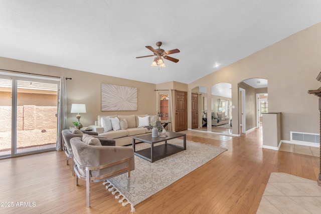 5822 W Abraham Ln, Glendale, AZ 85308 - living room with arched walkways, ceiling fan, and light wood-style flooring