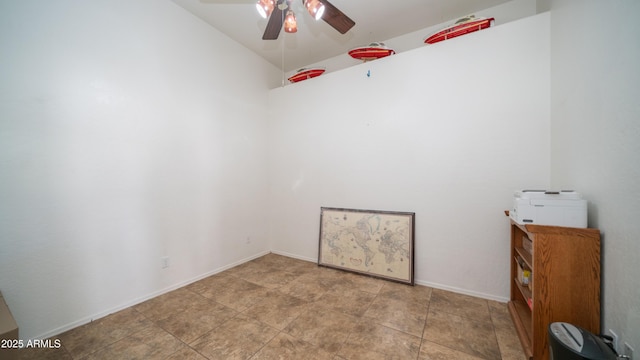 unfurnished room with ceiling fan and baseboards