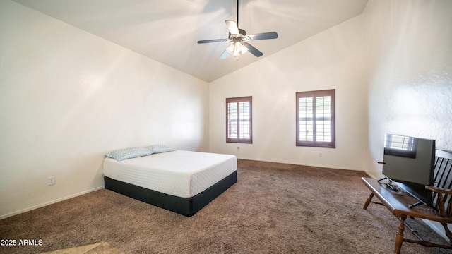 carpeted bedroom featuring high vaulted ceiling, ceiling fan, and baseboards