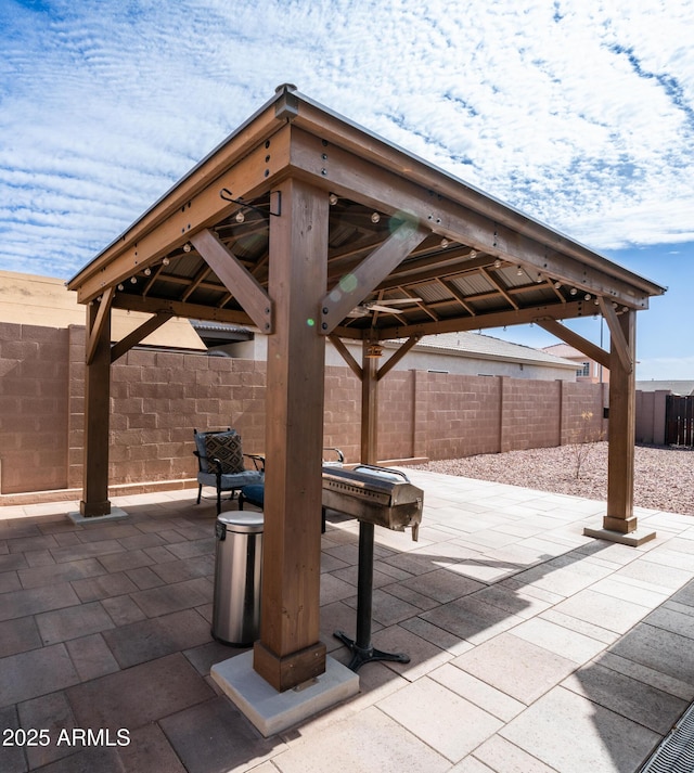 view of patio with a fenced backyard and a gazebo