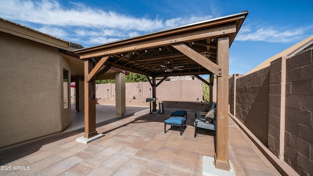 view of patio / terrace with a ceiling fan and a fenced backyard