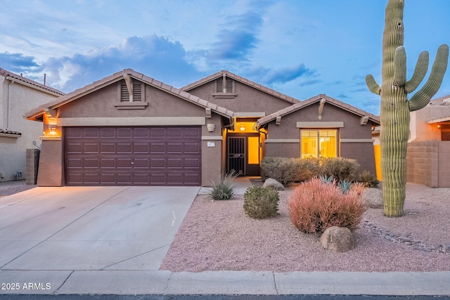 ranch-style home featuring a garage