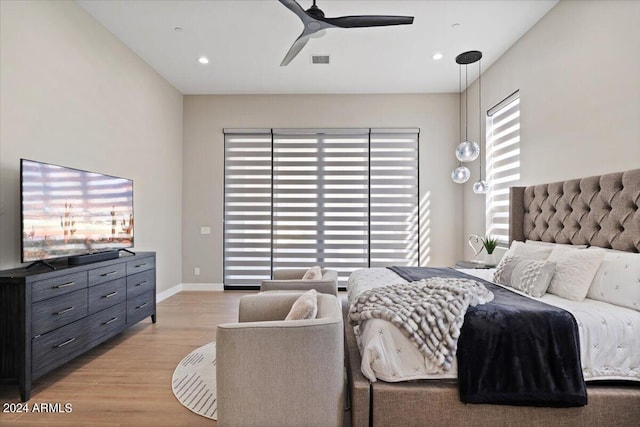 bedroom featuring light wood-type flooring and ceiling fan