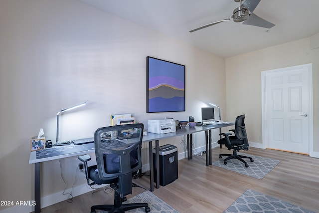 office space featuring light hardwood / wood-style flooring and ceiling fan