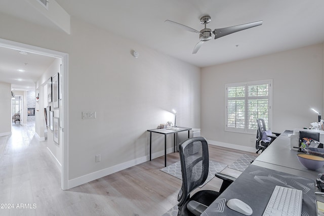 office space featuring ceiling fan and light hardwood / wood-style floors