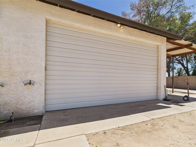 garage with fence