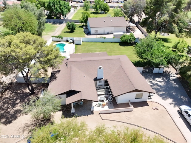 aerial view of property and surrounding area with a pool