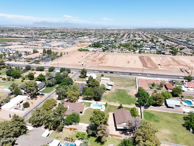 aerial view of residential area featuring a mountain backdrop