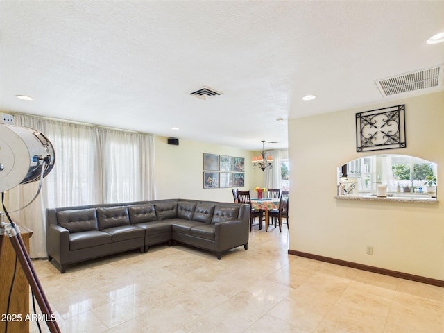 living room with a chandelier, baseboards, recessed lighting, and light tile patterned flooring