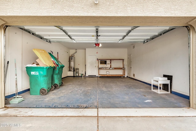 garage featuring gas water heater and a garage door opener