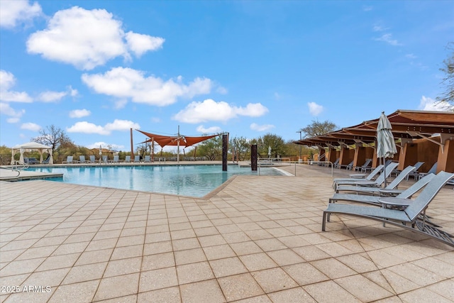 community pool with a patio area