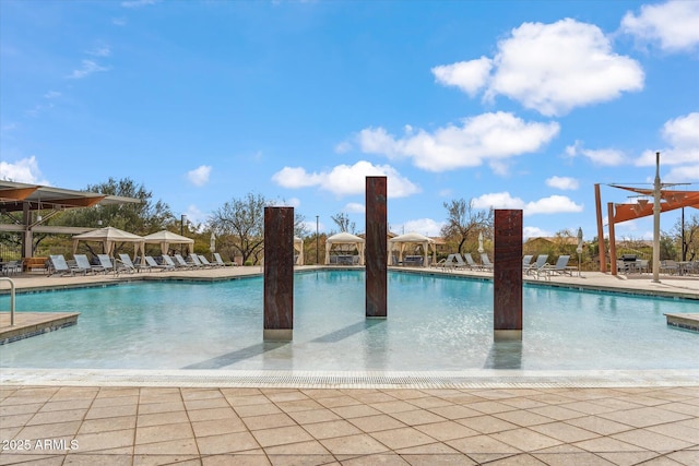 pool featuring a patio area and a gazebo