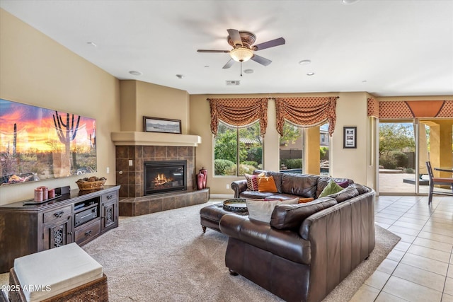 tiled living area featuring visible vents, ceiling fan, carpet flooring, a fireplace, and recessed lighting