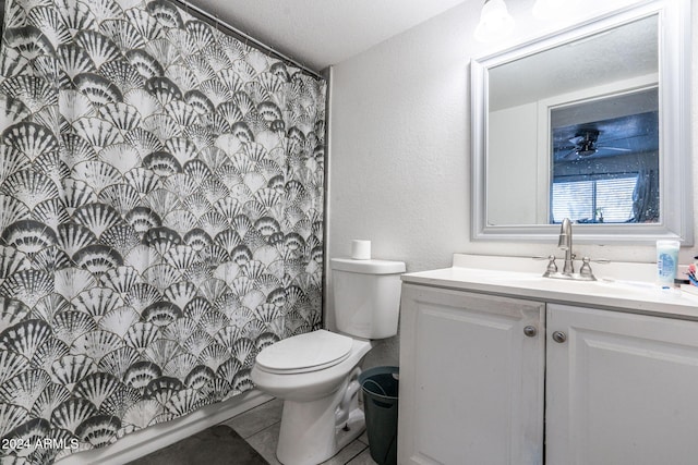 full bathroom with toilet, a textured wall, a shower with curtain, and vanity