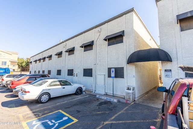 view of property with uncovered parking