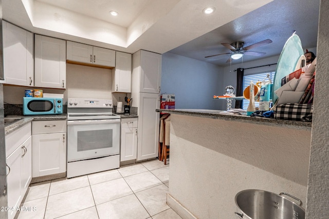 kitchen with white cabinets, ceiling fan, electric stove, recessed lighting, and light tile patterned floors