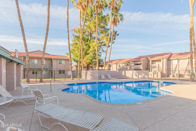 view of swimming pool with a patio area