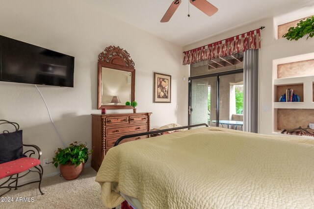 carpeted bedroom with access to outside and ceiling fan