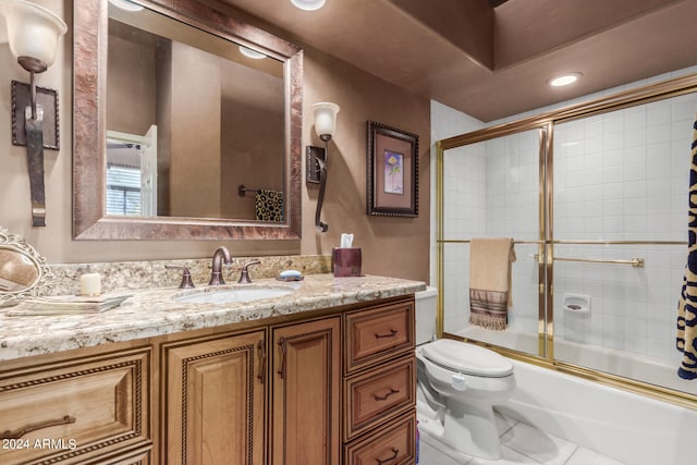 full bathroom with tile patterned flooring, vanity, enclosed tub / shower combo, and toilet