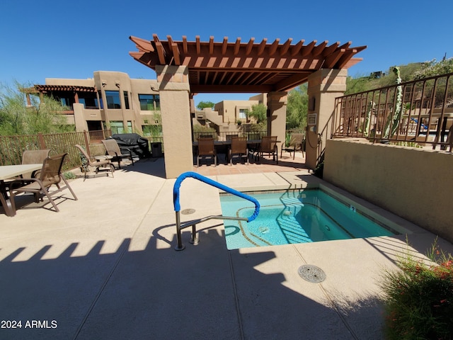 view of swimming pool featuring a pergola and a patio area