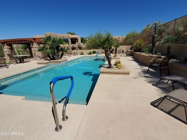 view of swimming pool featuring a patio