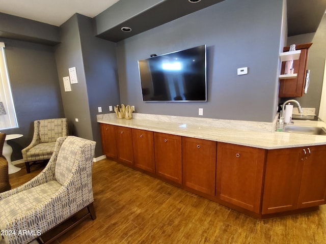 interior space with sink and hardwood / wood-style floors