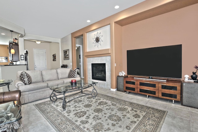 tiled living room featuring a fireplace