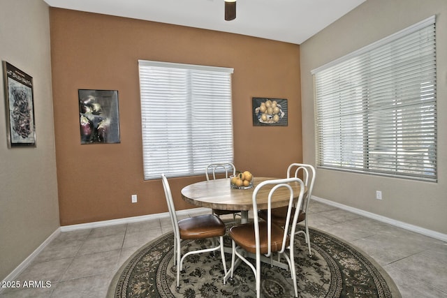 dining room with ceiling fan and light tile patterned floors