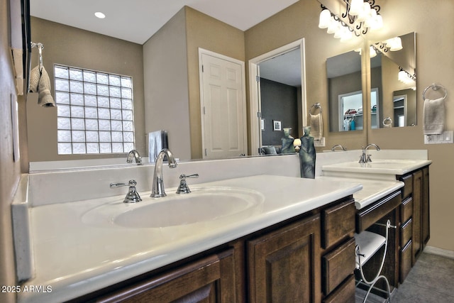 bathroom with tile patterned flooring and vanity