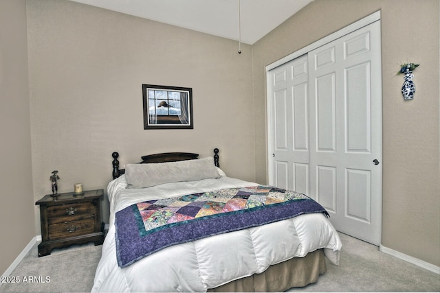 carpeted bedroom featuring a closet