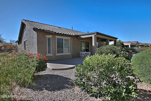 rear view of property with a patio