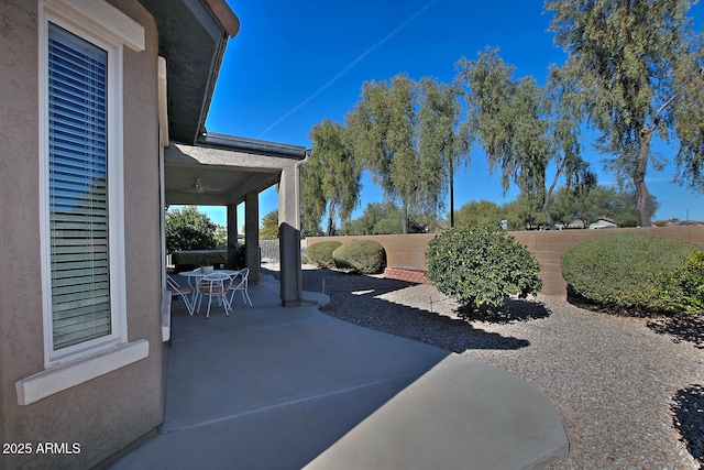 view of patio featuring ceiling fan