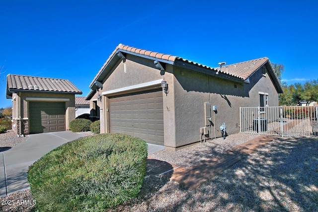 view of side of property with a garage