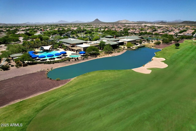 drone / aerial view featuring a water and mountain view