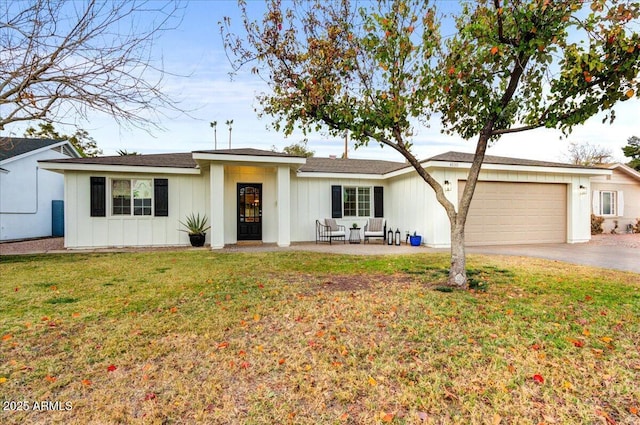 single story home featuring a front yard and a garage