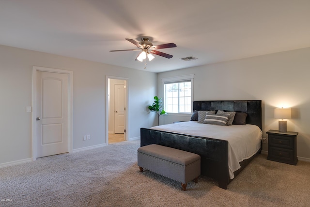 bedroom featuring ceiling fan and light carpet