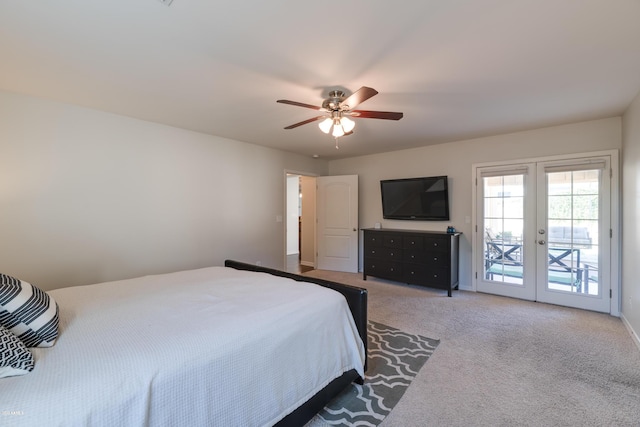 carpeted bedroom with access to exterior, ceiling fan, and french doors