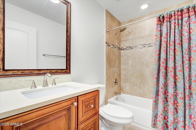 full bathroom with shower / bath combo, vanity, and toilet