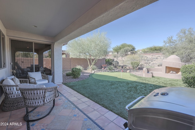 view of patio / terrace featuring exterior fireplace