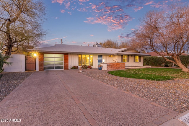 ranch-style home with a yard