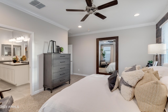 bedroom featuring light carpet, ensuite bathroom, ceiling fan, and ornamental molding