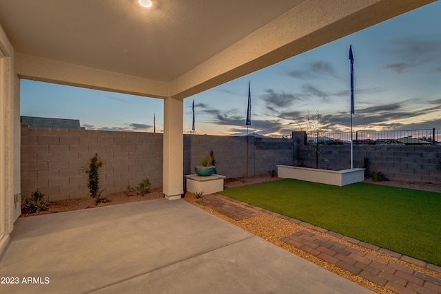 patio terrace at dusk with a yard