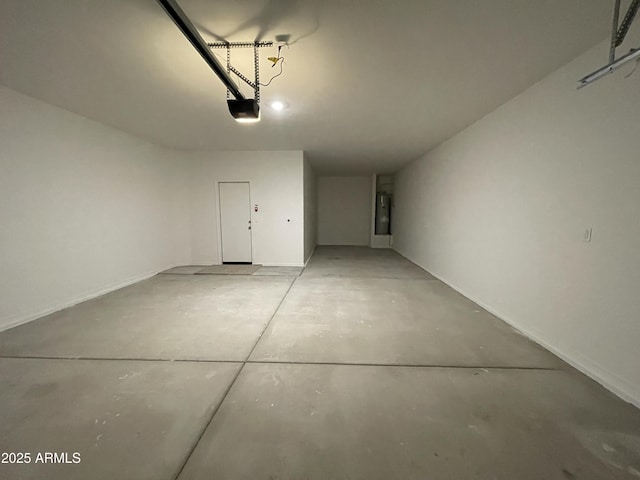 garage featuring secured water heater and a garage door opener