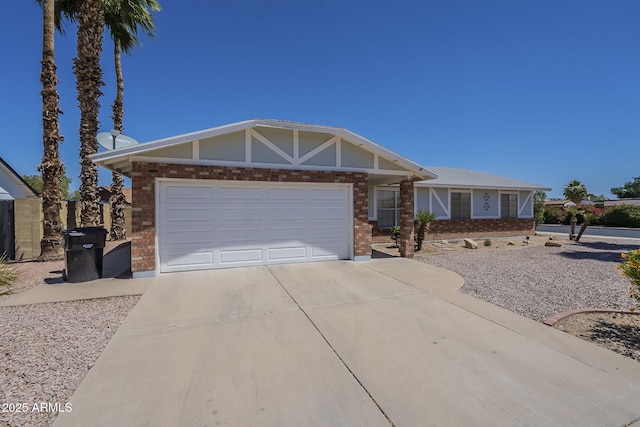 view of front of house featuring concrete driveway, brick siding, and an attached garage