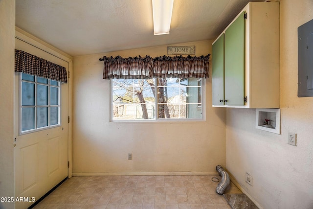 laundry area with electric panel, cabinet space, baseboards, and washer hookup